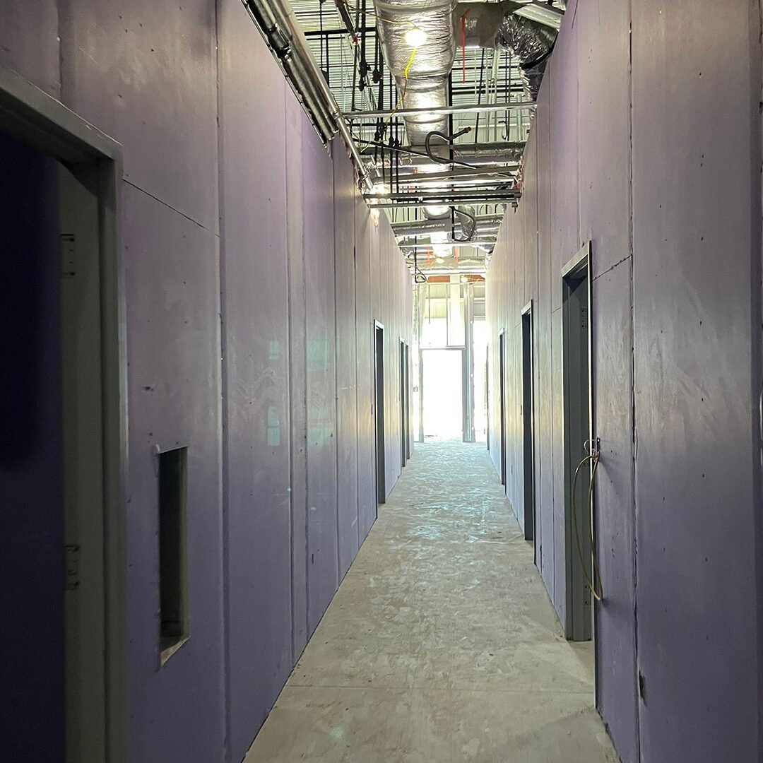 Drywall installation in a commercial corridor