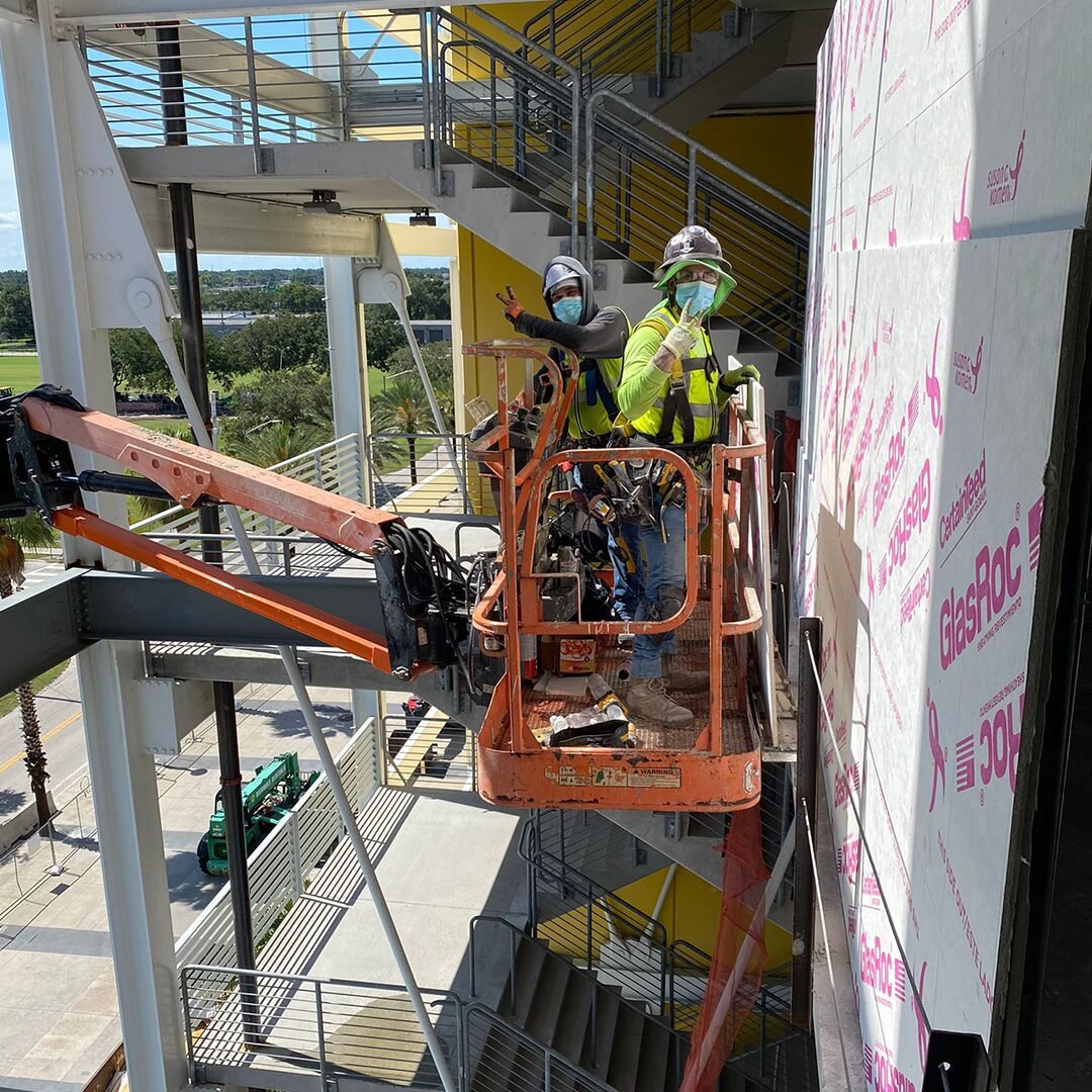 MacroPro crew working from a boom lift