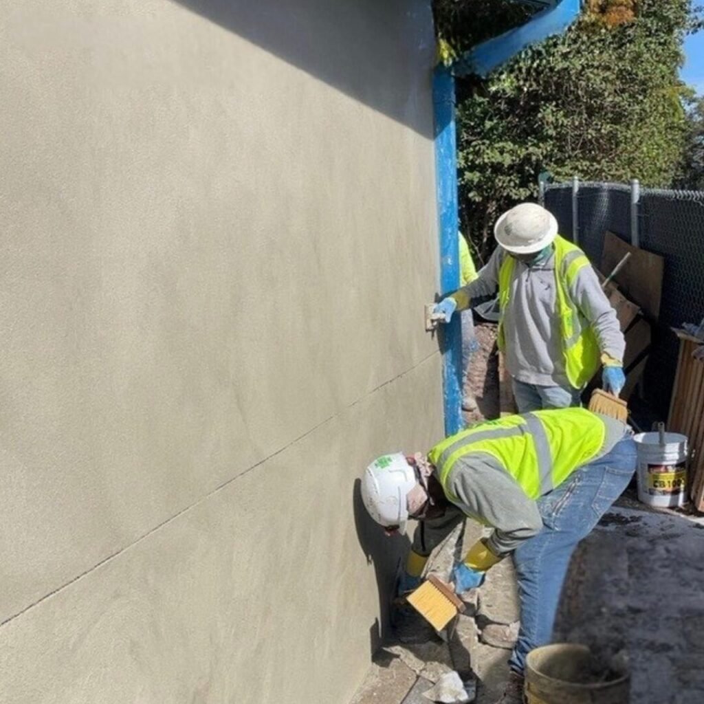 Crew applying texture finish